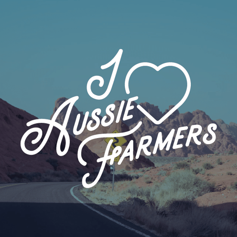 I Love Aussie Farmers text against a mountain background