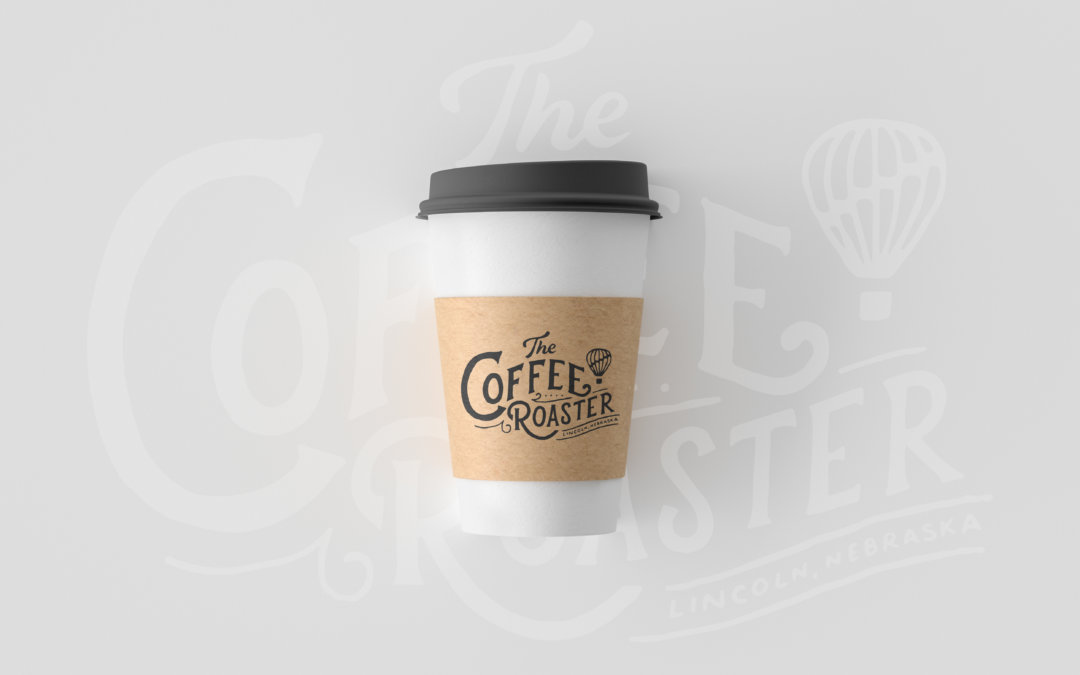 Coffee Roaster branded coffee cup in front of hand-lettered background